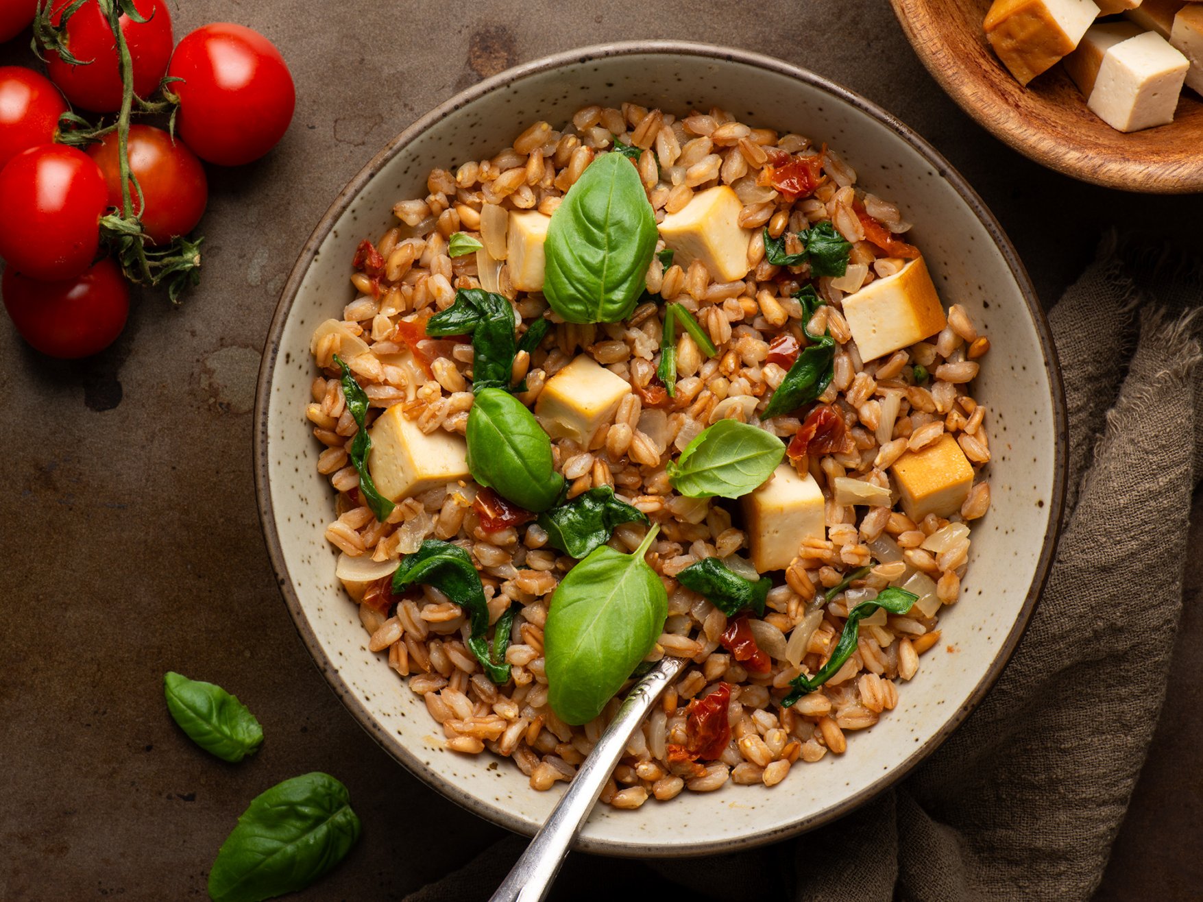 Food photography dark and moody farro with smoked tofu