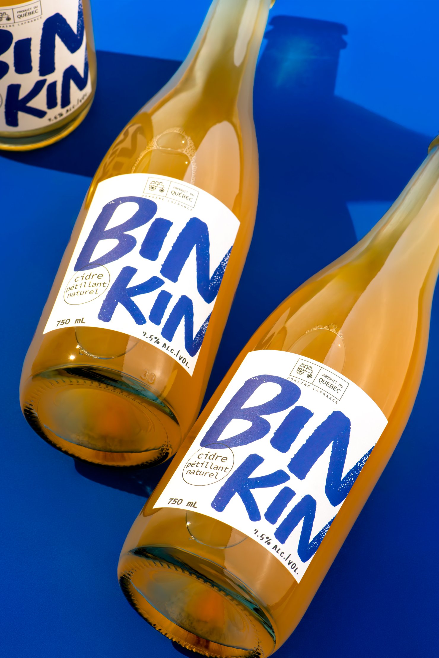 Three bottles of Quebec made Binkin cider displayed playfully