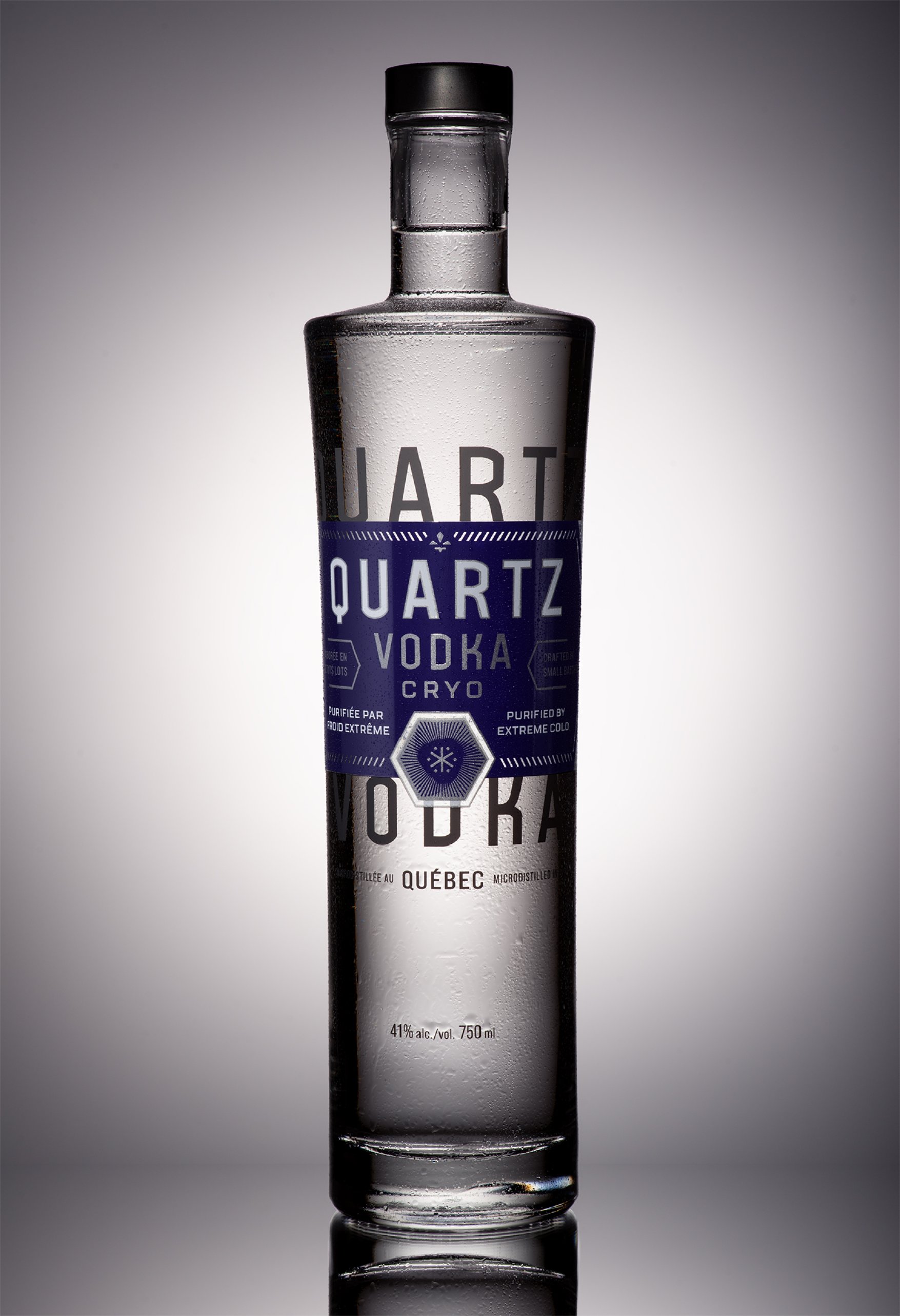 Dramatic lighting behind bottle of Quartz Vodka Cryo Quebec